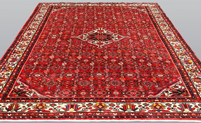 A Hosseinabad carpet, c 301 x 215 cm.