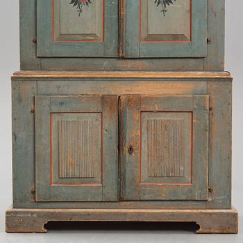 A polychrome-painted cabinet from Jämtland, Sweden, dated 1824.