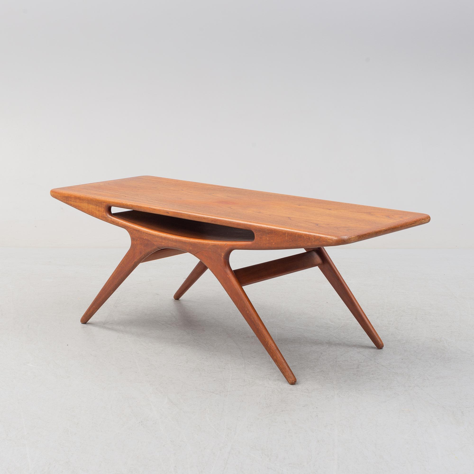 A 1950s teak veneered 'Smile' coffee table by Johannes Andersen for CFC Silkeborg, Denmark.