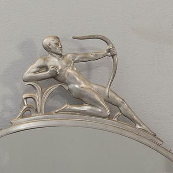 A first half of the 20th century art deco tin mirror.