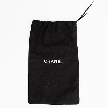 Chanel, a patent leather belt.