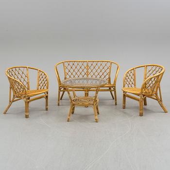 A bamboo and rattan sofa, pair of armchairs and table, second half of the 20th Century.