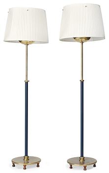 830. A pair of Josef Frank brass, partly lacquered in blue, floor lamps, Firma Svenskt Tenn.