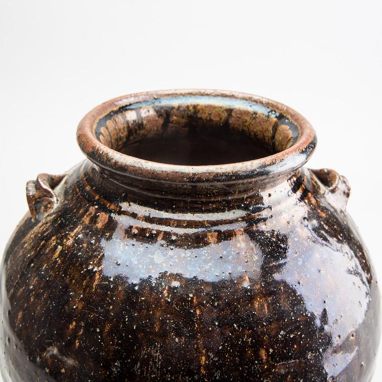 A South East Asian brown and black glazed jar, 14th/17th Century.