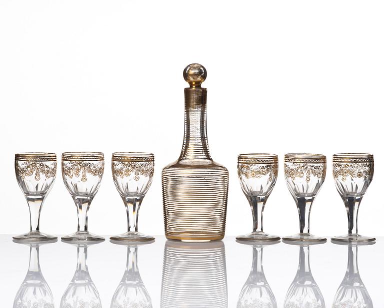 A set of six Russian glass goblets and a bottle with stopper, 19th Century.