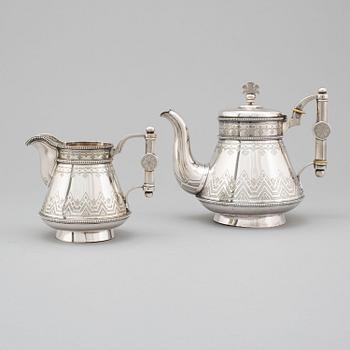 A Russian 19th century parcel-gilt silver tea pot and cream jug, mark possbly of Alexander Lokin, St. Petersburg 1893.