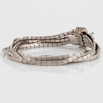 Armband 18K vitguld med fasettslipade smaragder.
