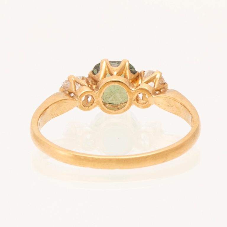 Ring in 18K gold with green faceted chrysoberyl and old-cut diamonds, Stockholm 1964.