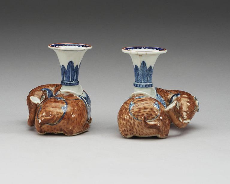 A pair of Export candle sticks in the shape of reclining elephants, Qing dynasty, Qianlong (1736-95).