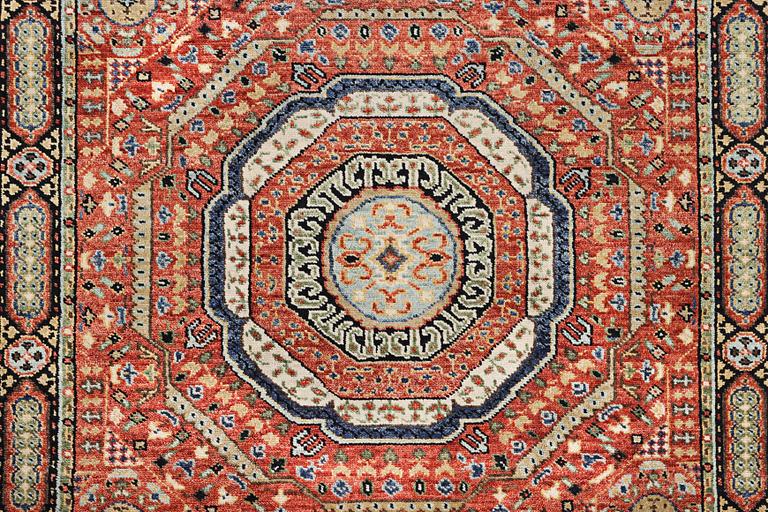 A carpet of Mamluk design, c. 307 x 243 cm.