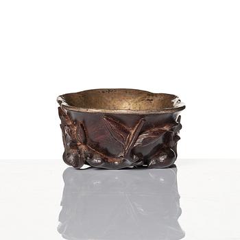 A sculptured wooden cup with silvered liner, Qing dynasty.
