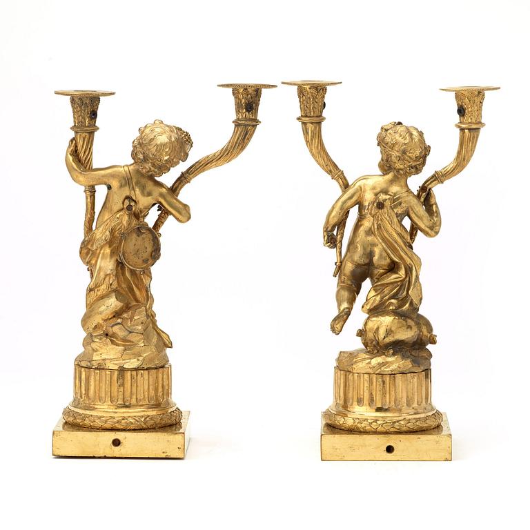 A pair of Louis XVI-style 19th century gilt bronze two-light candelabra.