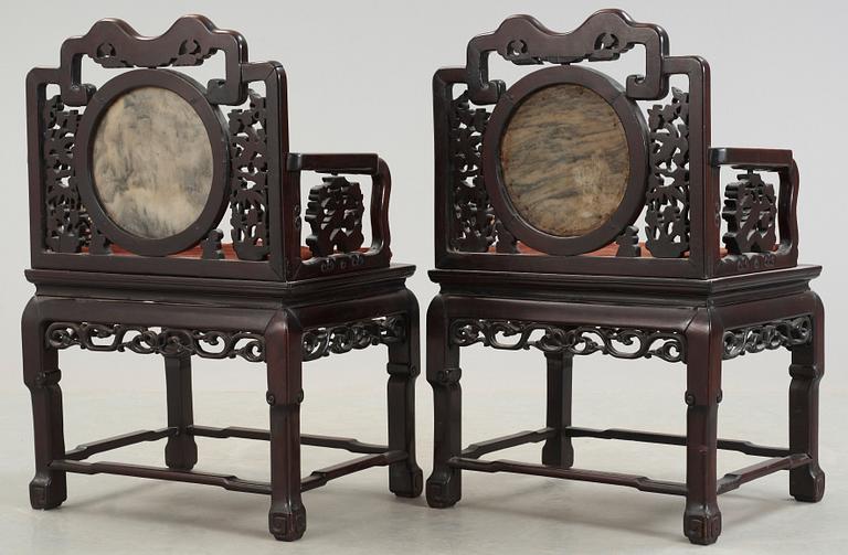 A pair of chinese hardwood and stone armchairs, first half of 20th Century.