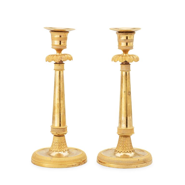 A pair of late Gustavian circa 1800 gilt bronze candlesticks.