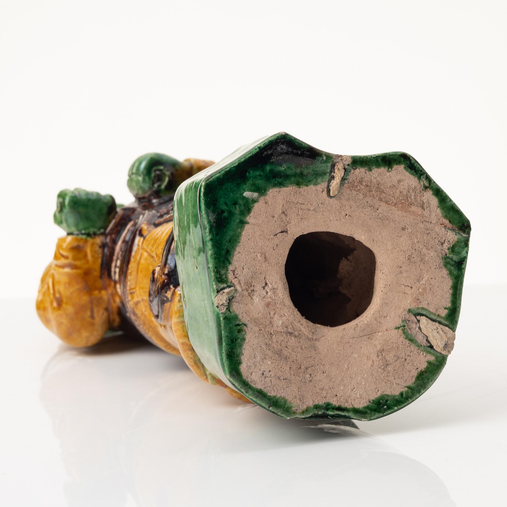 A stoneware figurine, China, Ming style but 20th century.