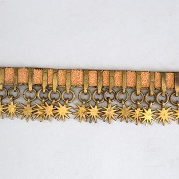 a brass and leather belt by Gustav Blomqvist 19th/20th century.