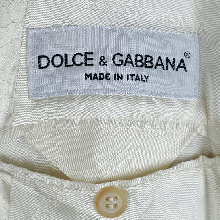 DOLCE & GABBANA, a creamecolored crocodile embossed men´s evening jacket, size 48.