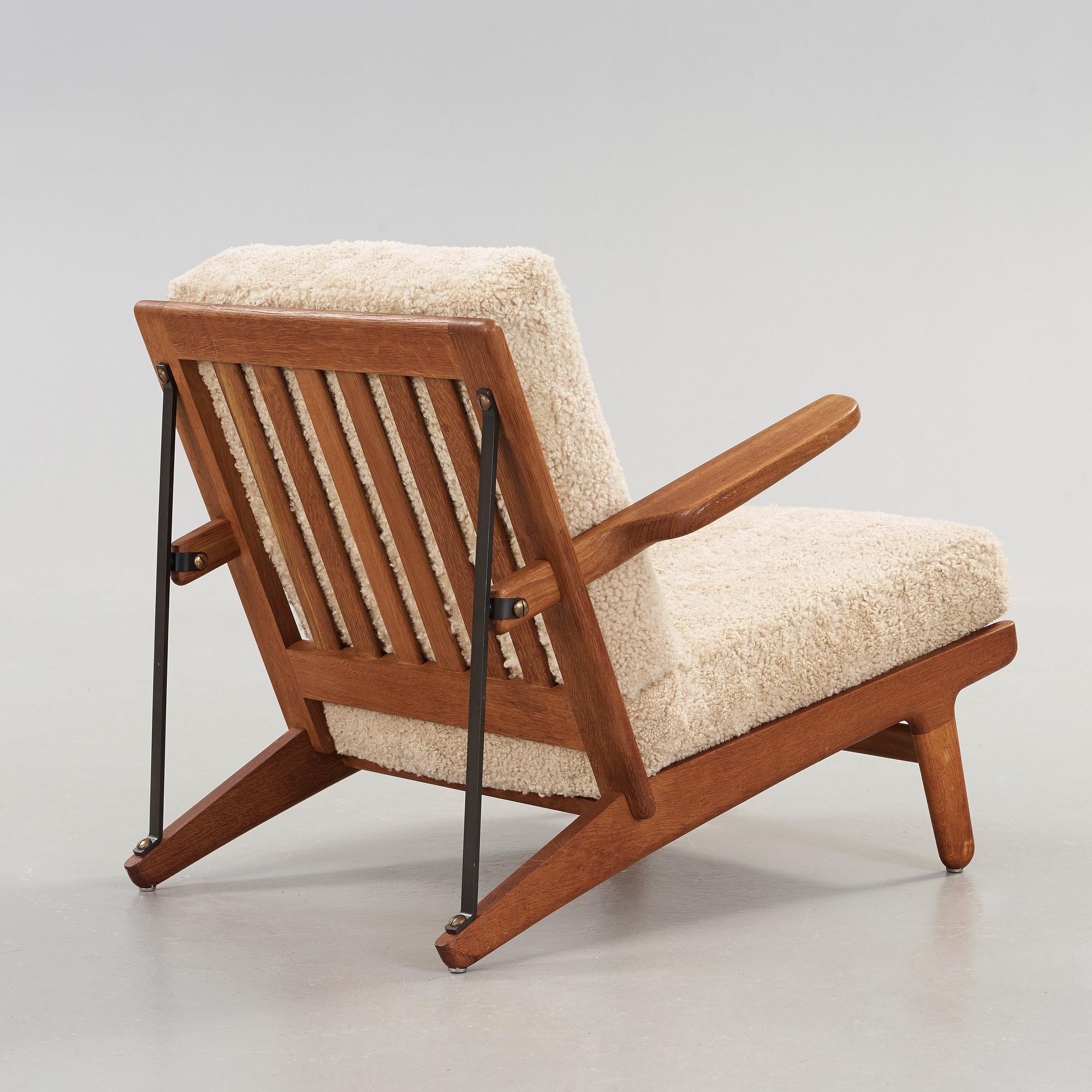 Børge Mogensen, an oak and iron easy chair, Fredericia, Denmark 1950's.