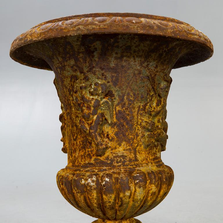 A pair of cast iron garden urns fist half of the 20th century.