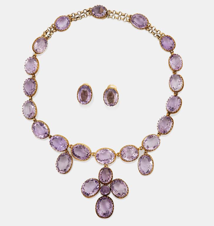 A necklace and a pair of earrings in silver set with amethysts.