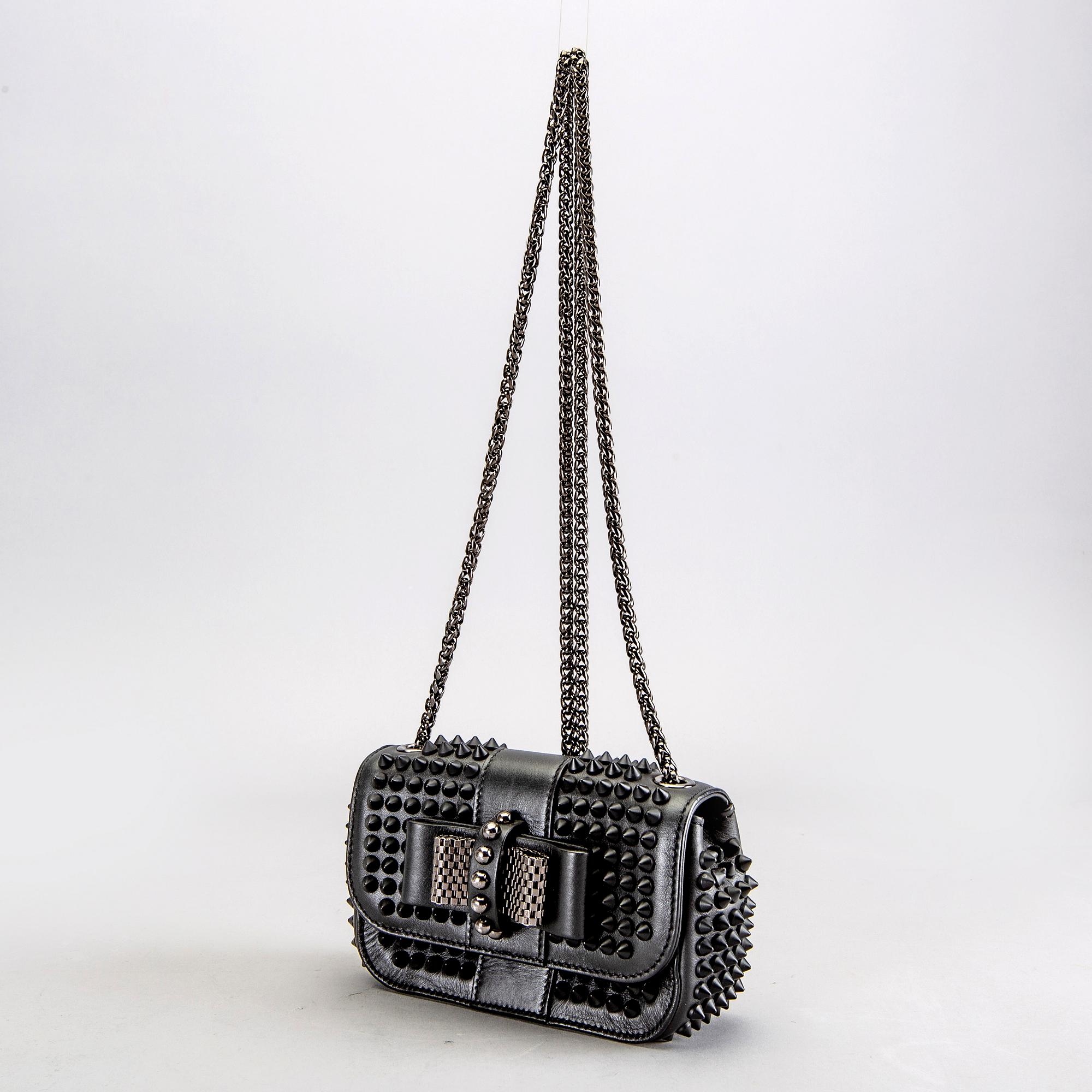 A Christian Louboutin Sweet charity leather mini bag. Bukowskis