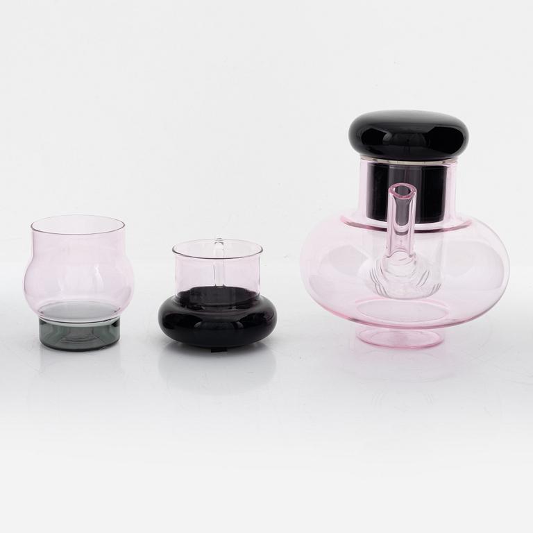 Tom Dixon, A 'Bump' glass teapot with for cups and a pair of glasses.