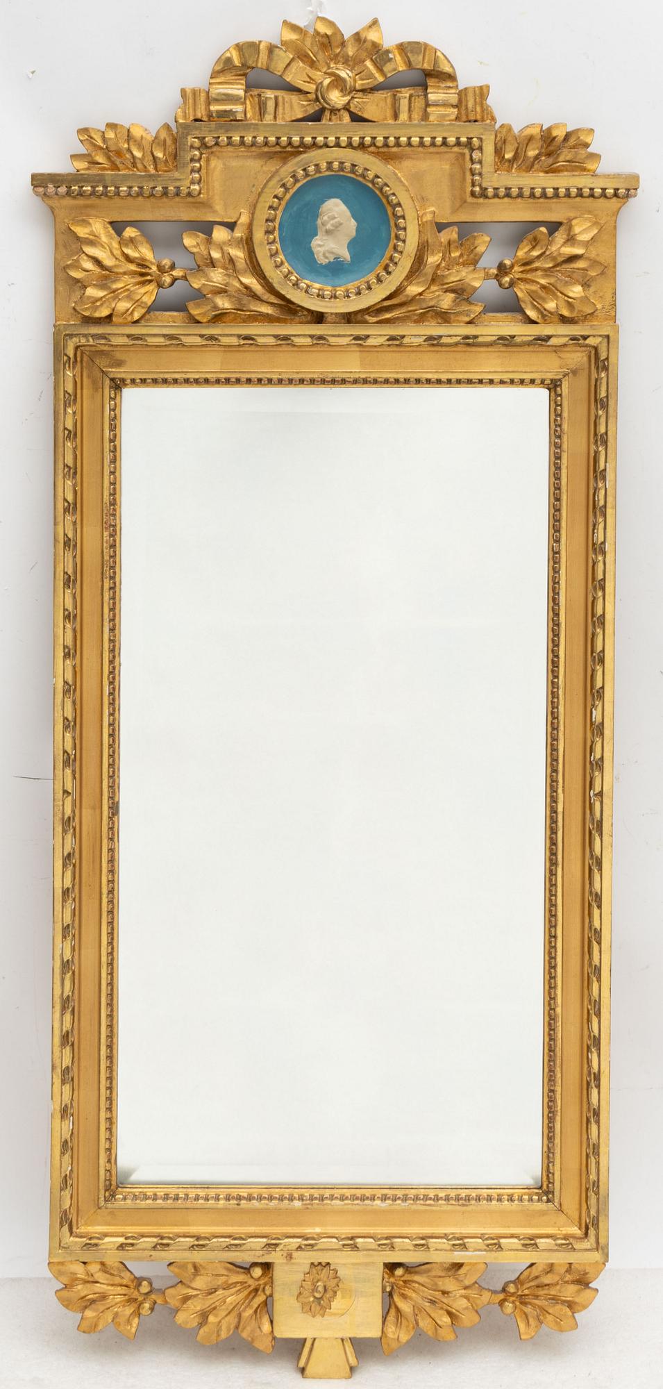 A Gustavian style mirror by John Lundmark, early 20th Century.