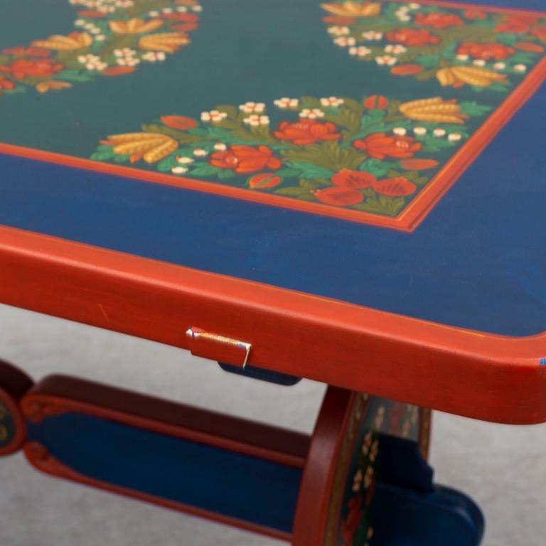 A second half of the 20th Century dining table and four chairs painted by the Hungrarian artist Laszlo Holló.