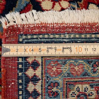 An antique Kashan Dabir carpet, c. 404 x 312 cm.