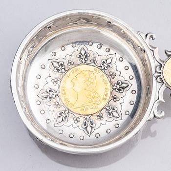 An 18th century French parcel-gilt silver tasse du vin (wine taster).