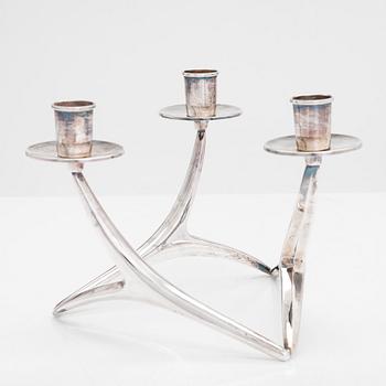 Anna-Greta Eker, a three-armed silver candelabrum, Auran Kultaseppä Oy, Turku, Finland 1995.