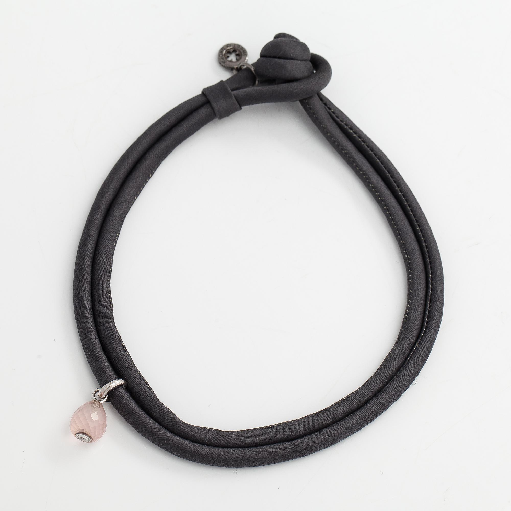 Ole Lynggaard, A silk, rose quartz, diamond 0.015 ct and 18K white gold bracelet. Denmark.