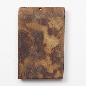 A group of three archaistic Chinese stone bi discs and two pendants.