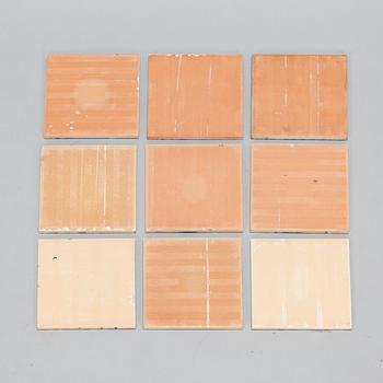 A set of nine earthenware tile plates, after Salvador Dalí, late 20th century.