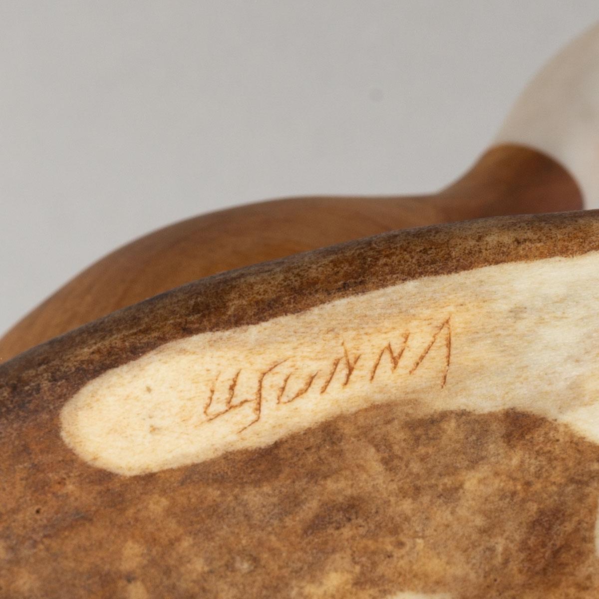 Lars Levi Sunna, a reindeer horn and birch figurine of a grouse, signed.