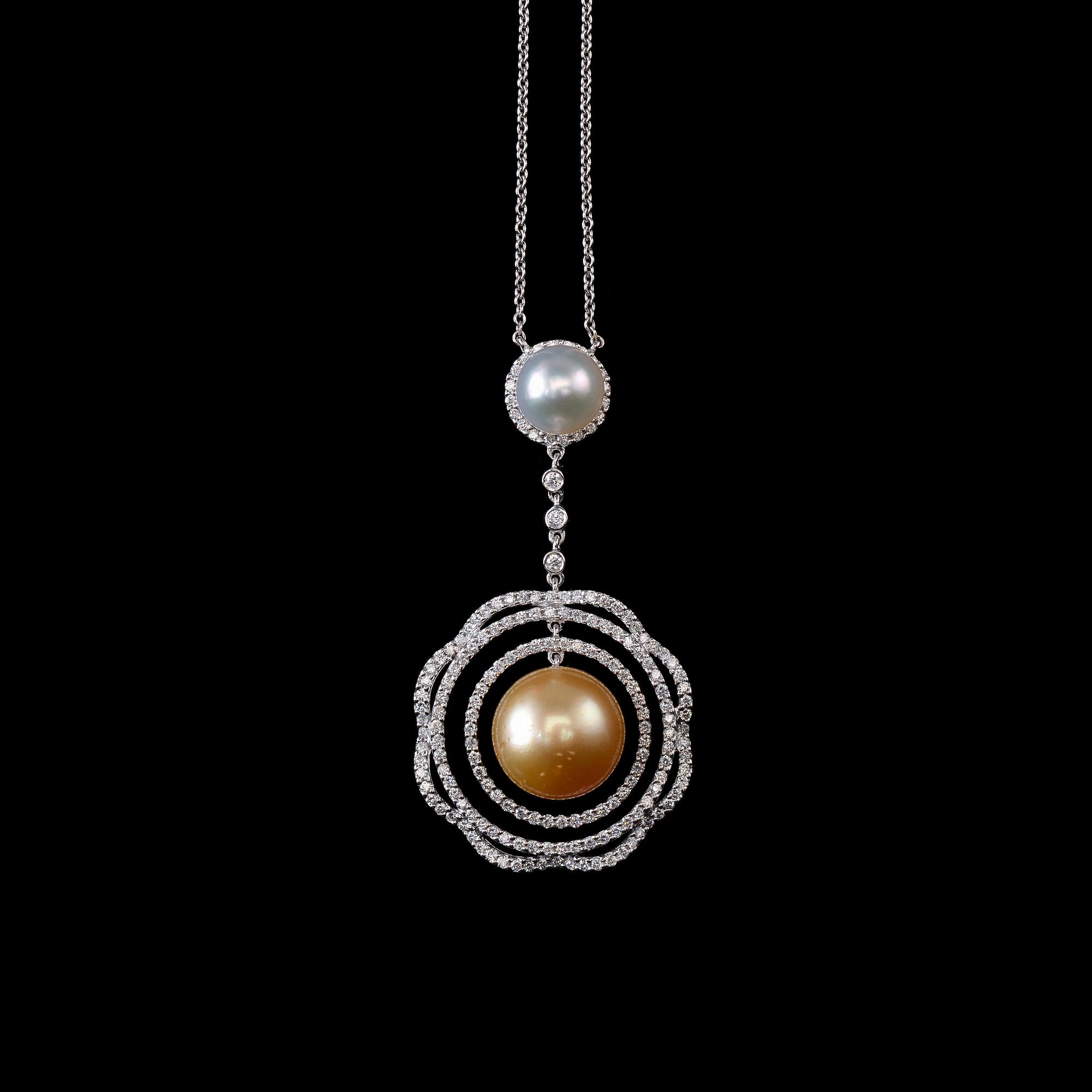 A PENDANT, brilliant cut diamonds c. 1.42 ct. South sea pearls 9 and 14 mm. 18K white gold, weight 15,6 g.