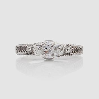 1236. A marquise-cut diamond, circa 0.85 ct, and brilliant-cut and princess-cut diamonds, circa 0.75 ct in total, ring.