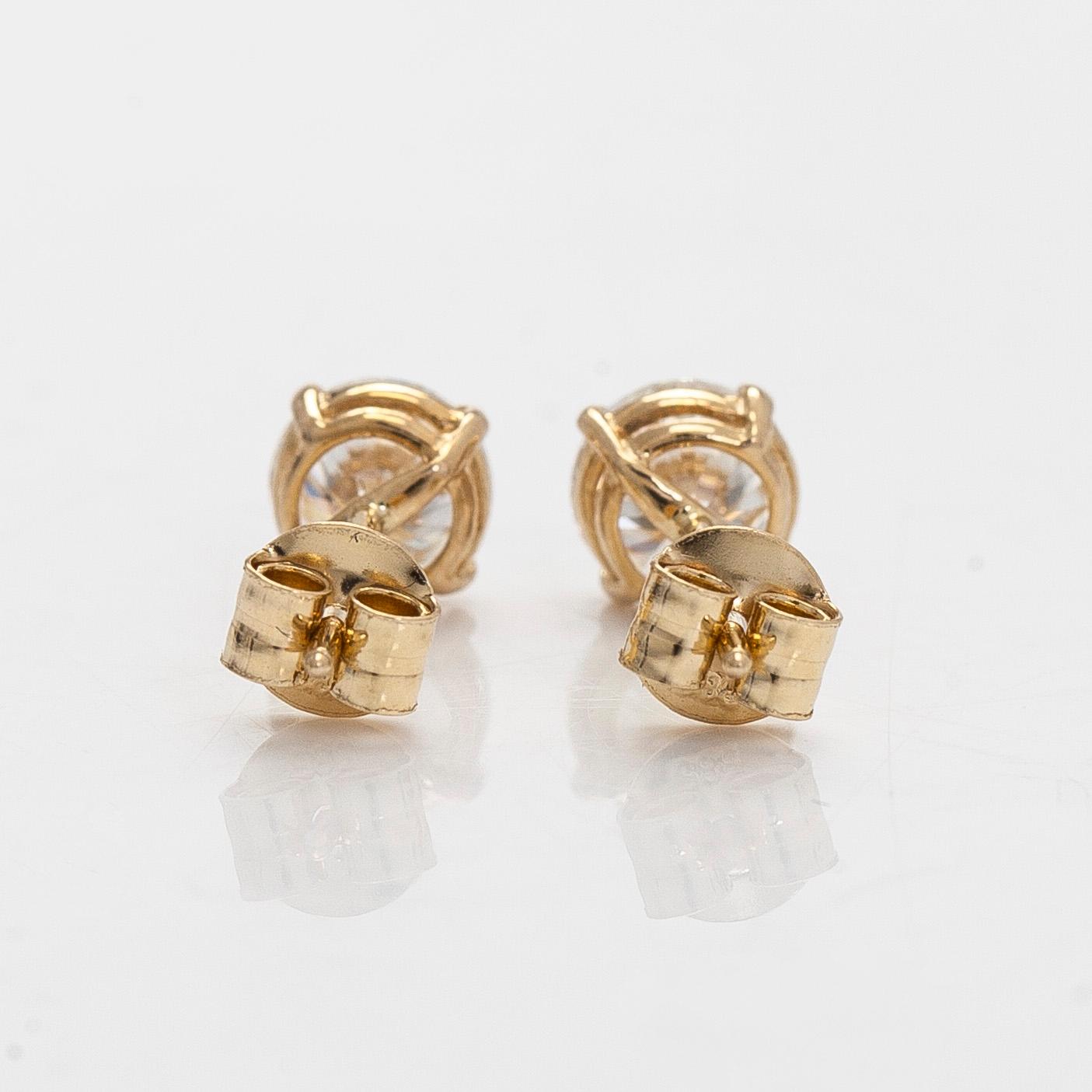 Earrings, brilliant-cut diamonds totalling 1.0 ct, 14K gold.