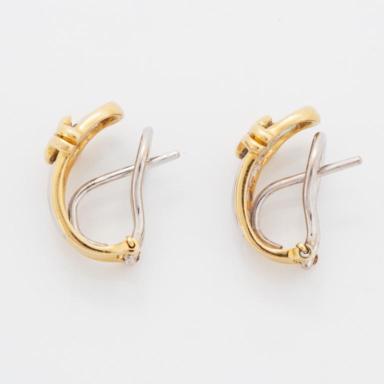 A pair of 18K gold earrings.