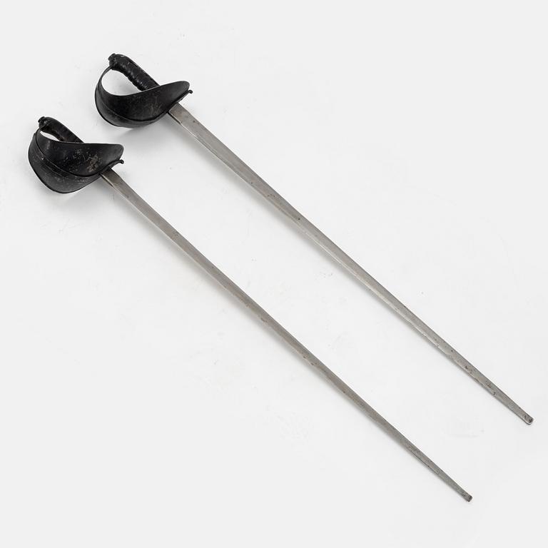 A Swedish pair of military practice swords 1886 pattern.