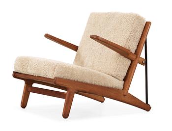 21. Børge Mogensen, an oak and iron easy chair, Fredericia, Denmark 1950's.