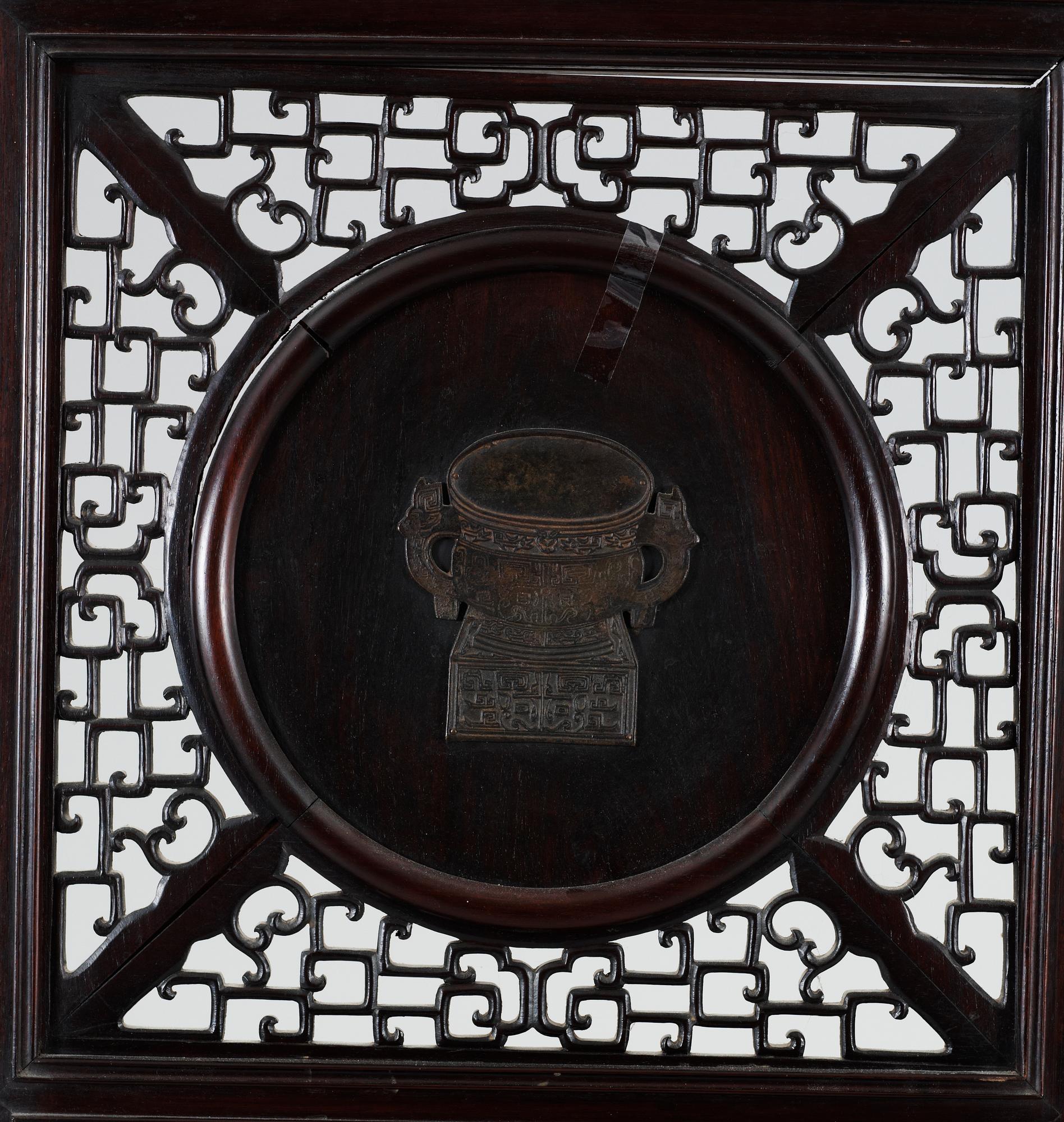 A four panel screen with porcelain placques, Qing dynasty, 19th Century.