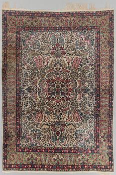 A SEMI-ANTIQUE KIRMAN RUG. 294X205.