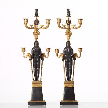 A pair of Russian Retour d'Egypte Empire Alexander I five-light candelabra, St. Petersburg.