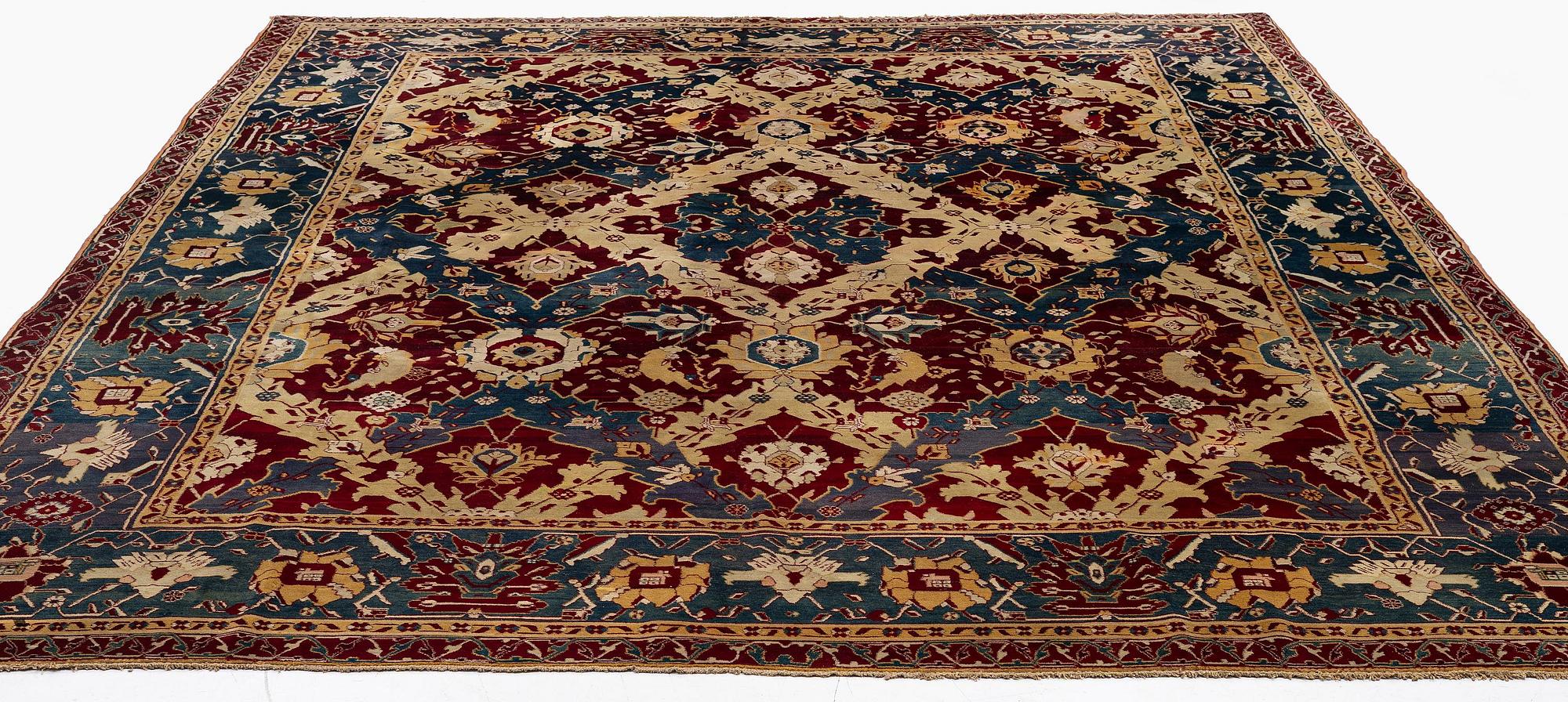 An Antique Agra carpet of 'Dragon Lattice' design, North India, 375 x 298 cm.
