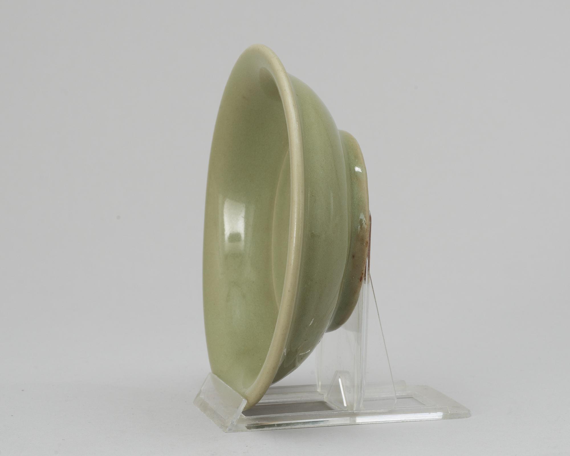 A celadon green Ming plate.