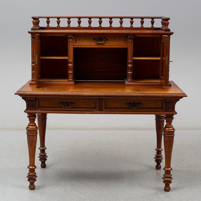 A late 19th century writing desk and armchair.