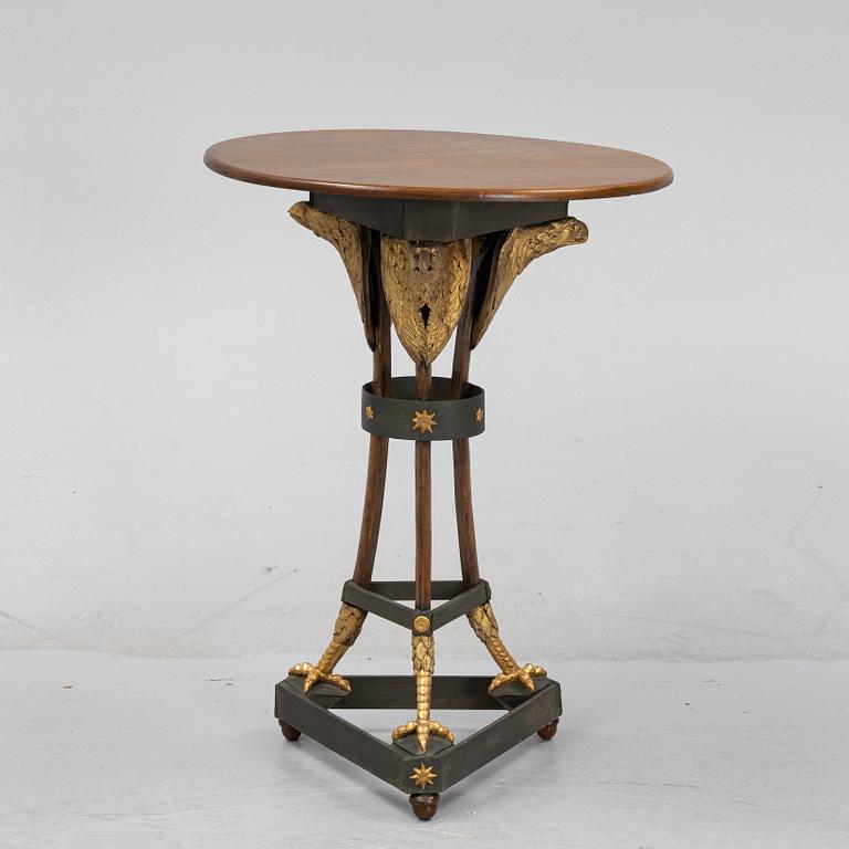 A presumably Russian giltwood and walnut Empire table, early 19th Century.