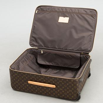 A Monogram Canvas Pégase 65 Suitcase with a Protective Cover.