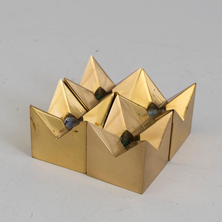 Four brass candlesticks by Pierre Forssell, Skultuna.